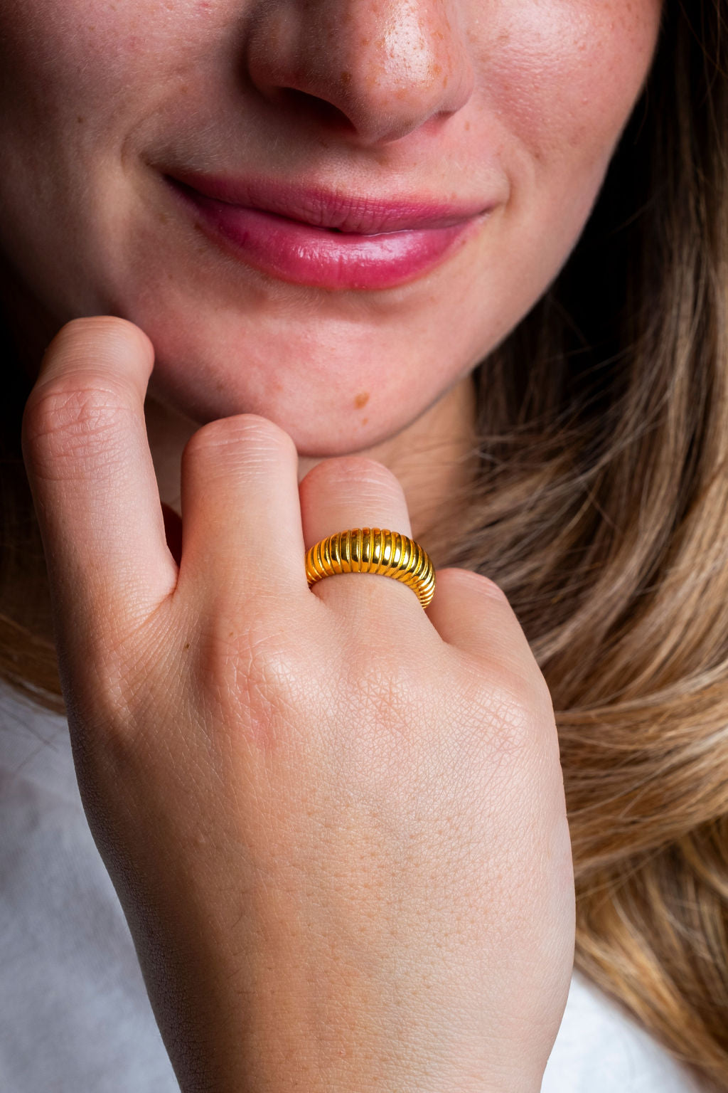 Gold croissant ring, sweatproof and tarnish-free, perfect for active individuals, worn by model
