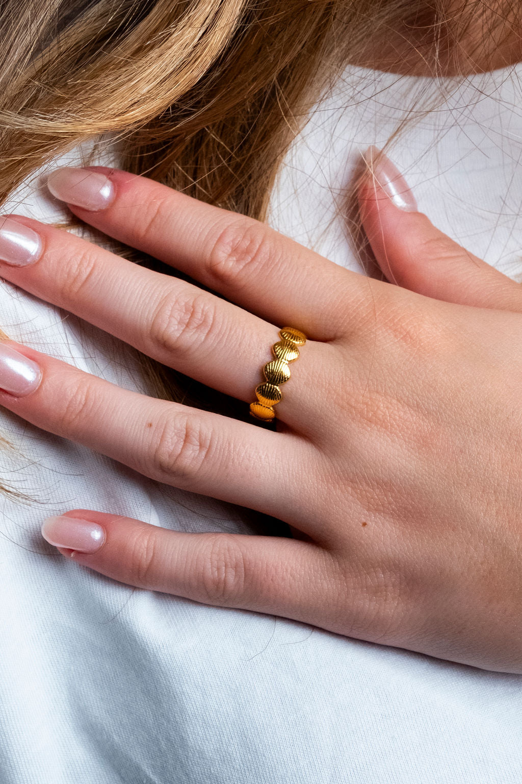 Gold shell ring, sweatproof and tarnish-free, perfect for active use, on model